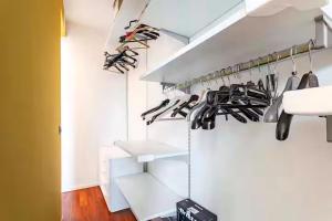 a closet with shoes hanging from the ceiling at Rifugio a due passi dal mare in Rimini