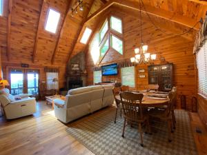 a living room with a table and a dining room at Honeys Haven in Morganton