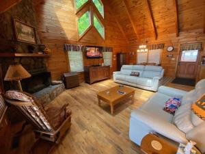 a living room with a couch and a fireplace at Honeys Haven in Morganton