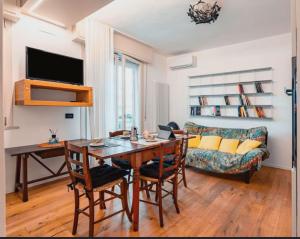 a living room with a table and a couch at Rifugio a due passi dal mare in Rimini