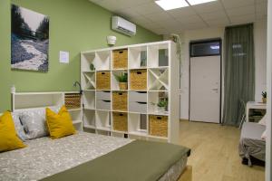 a room with a bed and a book shelf at Open Space Romagna 12 in San Benedetto del Tronto