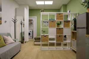 a room with a white shelf with plants in it at Open Space Romagna 12 in San Benedetto del Tronto +5 photos