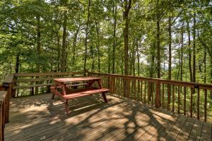 a wooden deck with a picnic table on it at Mountain Retreat in Morganton