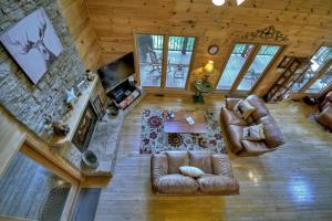 an overhead view of a living room with couches and a fireplace at My Mountain Paradise in Morganton
