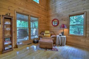 a living room with a chair and a table at My Mountain Paradise in Morganton