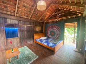 a bedroom with a bed in a wooden room at Berry homestay 1 in Buon Ma Thuot
