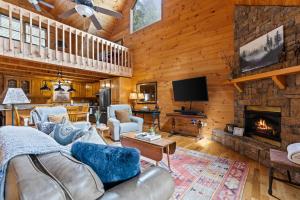 a living room with a couch and a fireplace at Oh Deer in Morganton +49 photos