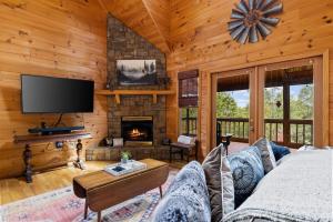a living room with a couch and a fireplace at Oh Deer in Morganton