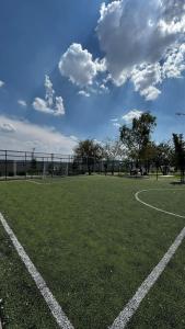an empty soccer field with a soccer goal at Casa completa y equipada in Saucillo de la Joya