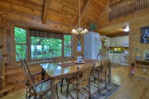 a kitchen and dining room with a table and chairs at RendezView in Morganton +27 photos
