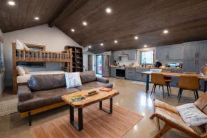 a living room with a couch and a bunk bed at Standing Rock Farms in Madison