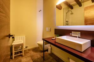 a bathroom with a sink and a toilet at Cal Compte in Torroja +28 photos