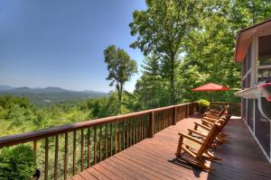a wooden deck with benches on the side of a house at Storybook in Morganton