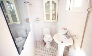 a white bathroom with a toilet and a sink at Anmyeondo Dream Pension in Taean +22 photos