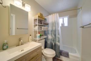 a bathroom with a sink and a toilet and a shower at Payson Summer Getaway w/ Backyard in Payson +16 photos
