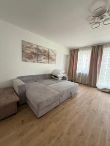 a living room with a bed and a couch at Marine Résidence in De Panne +27 photos