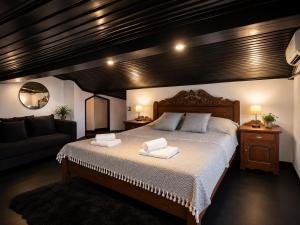 a bedroom with a large bed and a couch at Kartepe Mountain Villa in Kartepe