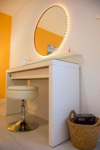 a bathroom with a vanity with a mirror at The Wee Shore House in Ayr +57 photos