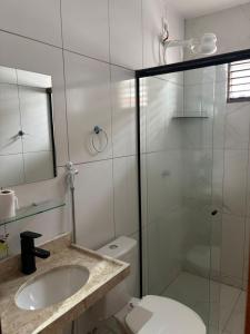 a bathroom with a shower and a sink and a toilet at Hotel pousada czar in João Pessoa +5 photos