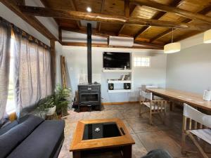 a living room with a couch and a table at Sierras de Canela premium in Tandil