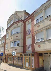 a building on the corner of a street at Zafir Luxory in Kaposvár