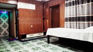 a room with a bed and a room with a door at Bliss Spa Gulshan - Spa in Gulshan in Bhola
