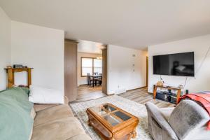 a living room with a couch and a tv at Explore the Upper Peninsula! Marquette Home in Marquette