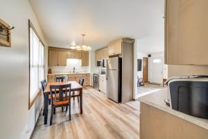 a kitchen with a table and a dining room at Explore the Upper Peninsula! Marquette Home in Marquette