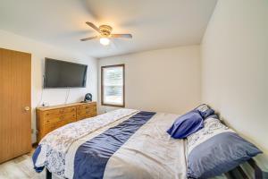 a bedroom with a bed and a ceiling fan at Explore the Upper Peninsula! Marquette Home in Marquette