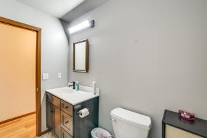 a bathroom with a white toilet and a sink at Explore the Upper Peninsula! Marquette Home in Marquette +15 photos