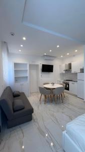 a living room with a couch and a table at Houses & Rooftop Pompei - Sky in Pompei