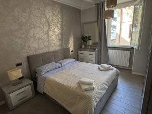 a bedroom with a bed with two towels on it at alloggioaltorrione in Citerna