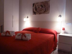 Łóżko lub łóżka w pokoju w obiekcie Belvedere di San Benedetto del Tronto affittacamere senza colazione