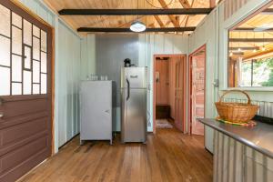 a kitchen with two refrigerators in a room at Cabana Paiol de Baixo in Curitiba