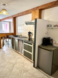a kitchen with a counter and a kitchen island at Studio Cosy et Moderne in Saint-Ambroix