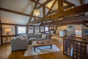 a living room with a couch and a table at Characterful Home Steps from Cathedral in Hereford