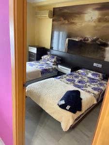 two beds in a small room with at Relaxe La cala in Villajoyosa +32 photos