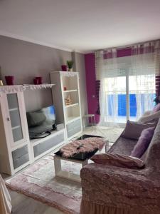 a living room with a couch and a table at Relaxe La cala in Villajoyosa
