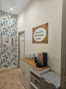 a kitchen with a counter with a microwave at Corte26 in Nocera Inferiore +57 photos
