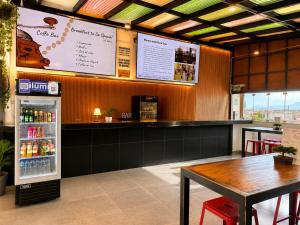 a fast food restaurant with a table and a refrigerator at Ica Adventures II in Ica