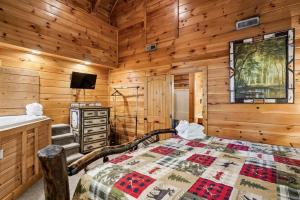 a bedroom with a bed and a sink at Scenic Serenity #75 by Venture Smoky Mountains in Sevierville +49 photos
