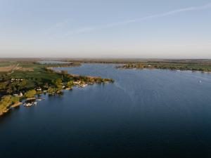 an aerial view of a large river with houses at Naturhaus Havelland in Rathenow +35 photos