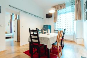 a dining room with a table and chairs at City Center Studio in Graz