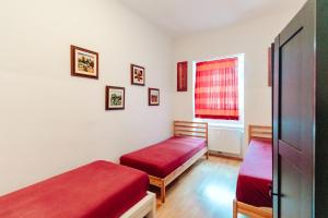 a bedroom with two beds and a window at City Center Studio in Graz +15 photos