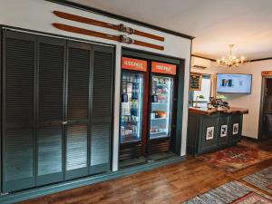 a store with two refrigerators and a counter at Hideaway Inn Mt Snow in Dover