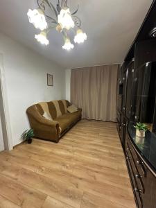 a living room with a couch and a table at Horodotska Street in Lviv