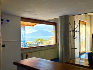 a room with a window with a view of the ocean at The Dreamer's Terrace in Vico Equense