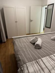 a bedroom with a bed with a towel on it at Chalet Relax in Birresborn