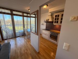 a living room with a kitchen and a dining room at Masti Apartment in Tallinn