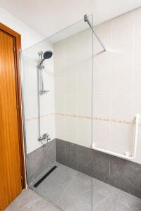 a bathroom with a shower with a glass door at Best Seaview in Larnaca - 2 BDR Apt - 2 Min Walk to Beach in Larnaca